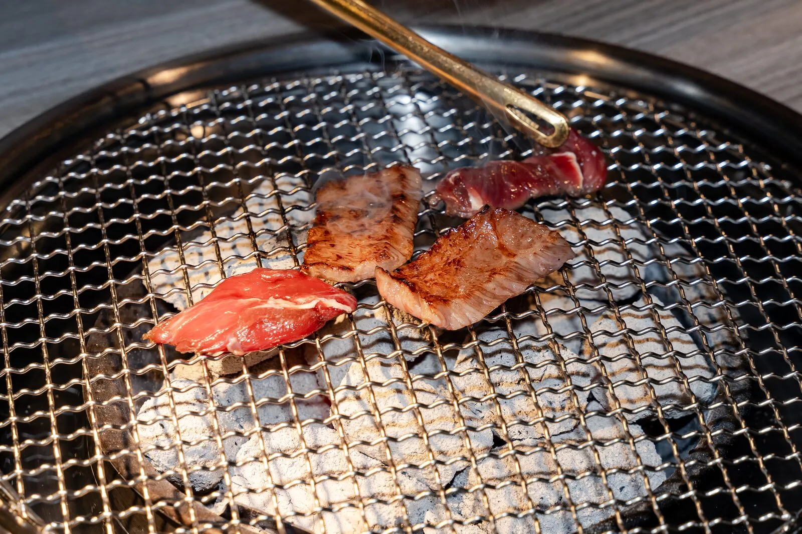 Beef grilling on the grate