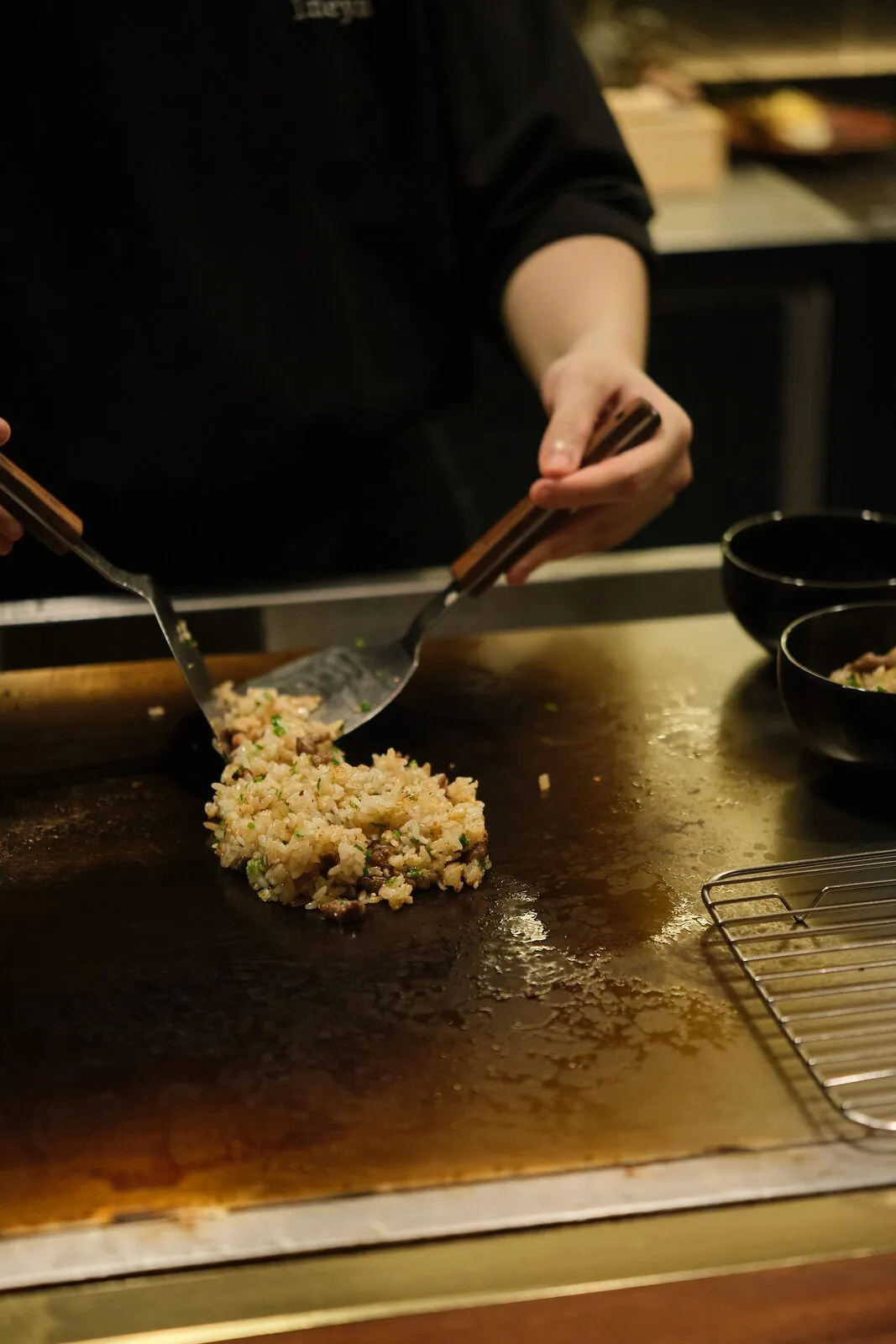 A dish being cooked on the teppan surface