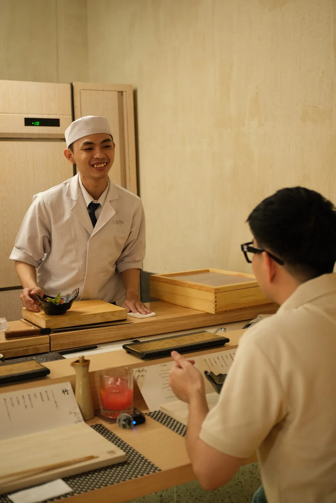 A guest watching the chef cook at the teppan counter