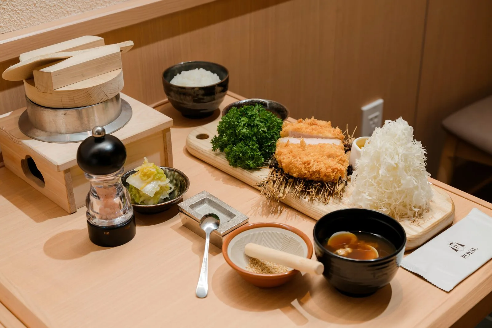 A full tonkatsu rice set with cabbage, rice and soup
