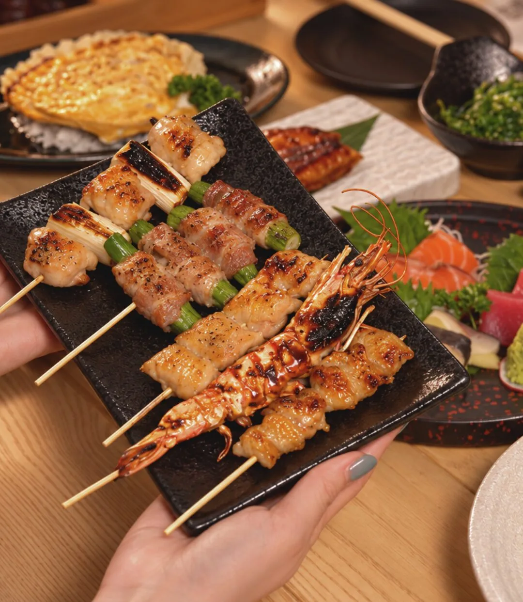 A platter of assorted grilled skewers with sashimi
